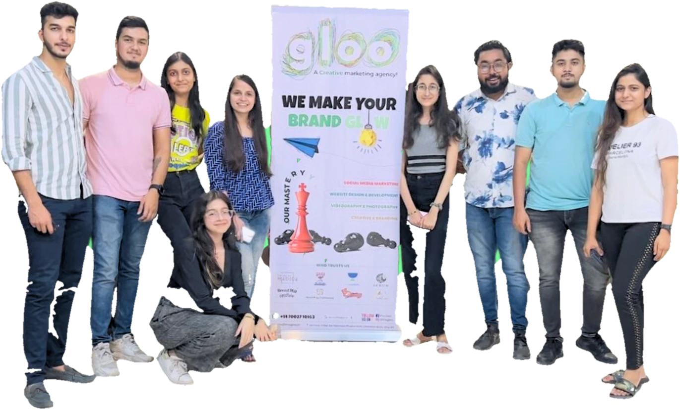 The Gloo crew in 2023 standing either side of a gloo "We make your brand glow" banner